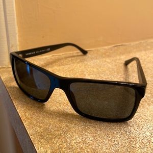 One pair of black unisex Versace sunglasses mint condition